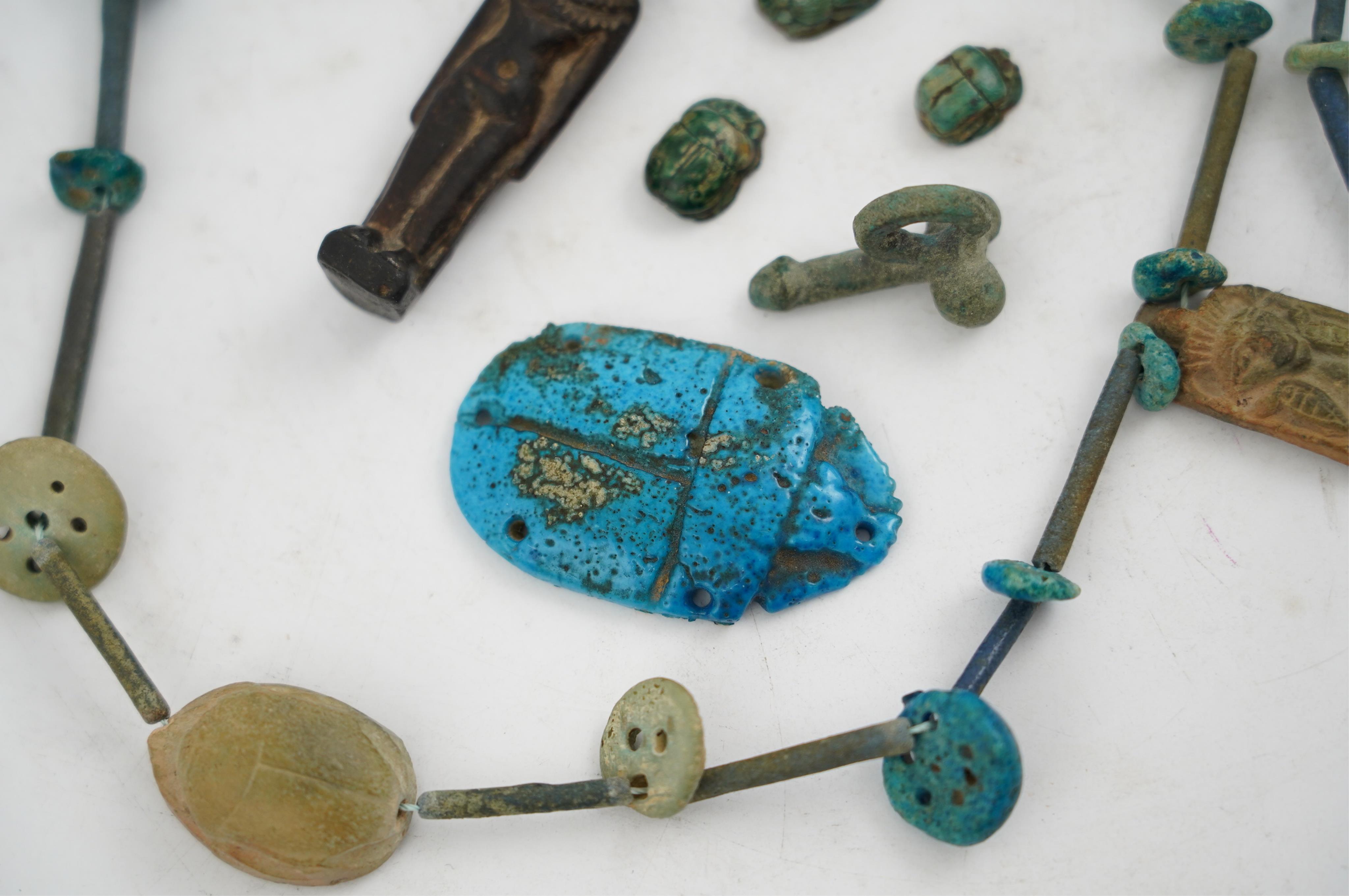 An ancient Egyptian faience necklace, amulets and scarabs, late Kingdom to Ptolemaic period